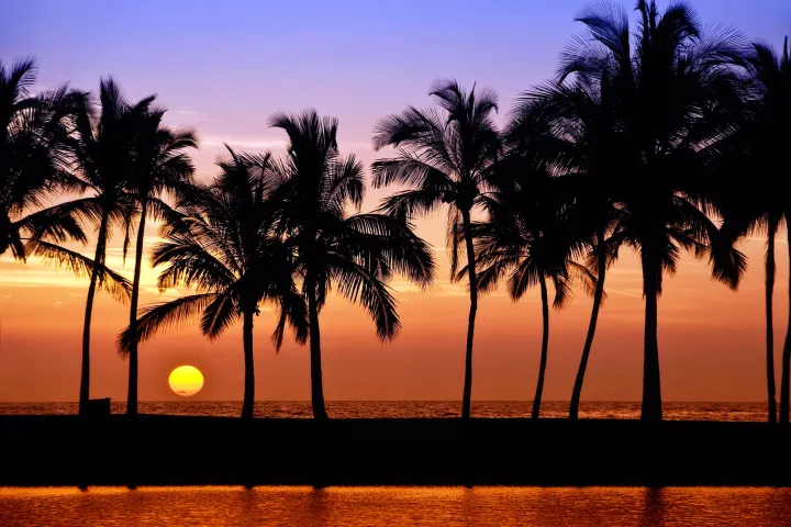 a sunset over a body of water