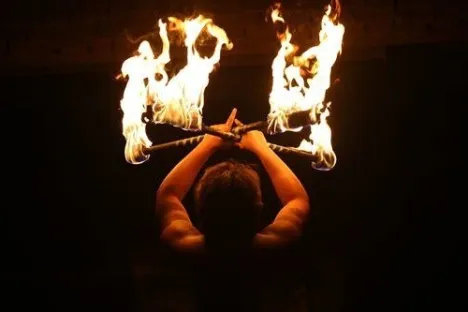 a person sitting in front of a fireplace