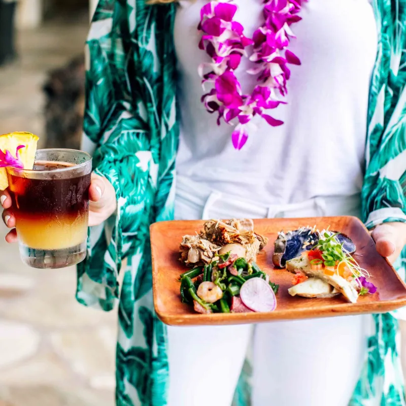 a person sitting at a table with a cup of coffee
